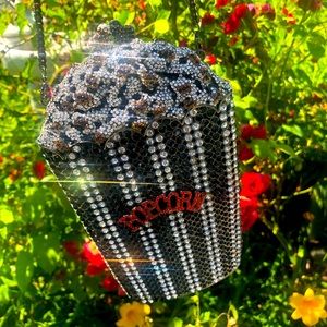“ POP POP “ popcorn bag in black and red.